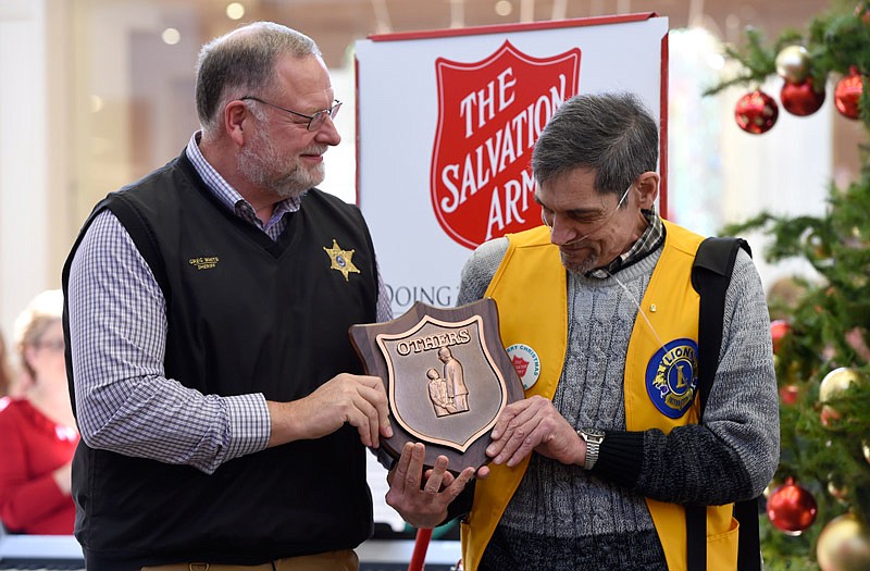 Cole County Sheriff Greg White presents the "Others" award Saturday, Nov. 12, 2016 to Wayne Osgoode at the Salvation Army's Red Kettle Campaign kick off at the Capital Mall in Jefferson City. The award is given to someone who displays extraordinary service to others at the Salvation Army.