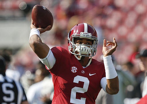 Alabama quarterback Jalen Hurts sets back and passes the ball before the first half of an NCAA college football game against Mississippi State, Saturday, Nov. 12, 2016, in Tuscaloosa, Ala.