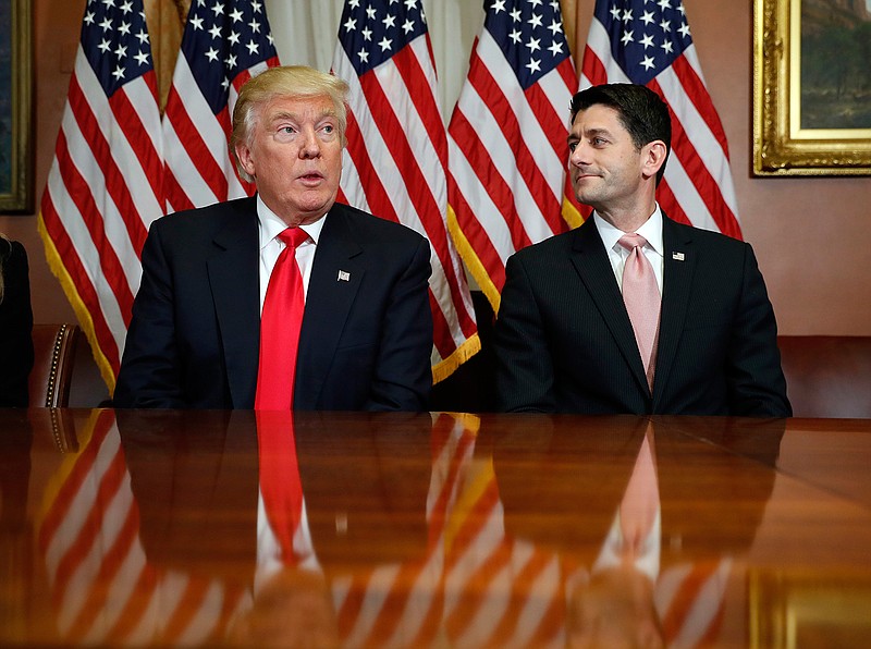 In this Nov. 10, 2016, photo, President-elect Donald Trump and House Speaker Paul Ryan of Wis., pose for photographers after a meeting in the Speaker's office on Capitol Hill in Washington. Washington's new power trio consists of a bombastic billionaire, a telegenic policy wonk, and a taciturn political tactician. How well they can get along will help determine what gets done over the next four years, and whether the new president's agenda founders or succeeds.