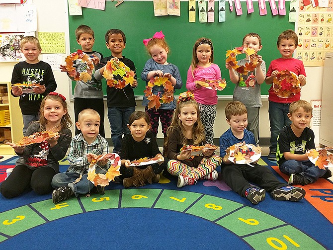 Students in Sandy McDaniel's Fulton Preschool class made leaf wreaths with the help of William Woods students. 