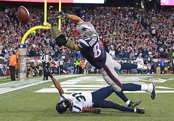 Patriots tight end Rob Gronkowski can't catch a pass in the end zone above Seahawks safety Kam Chancellor in the final moments of Sunday night's game in Foxborough, Mass. The Seahawks defeated the Patriots 31-24.