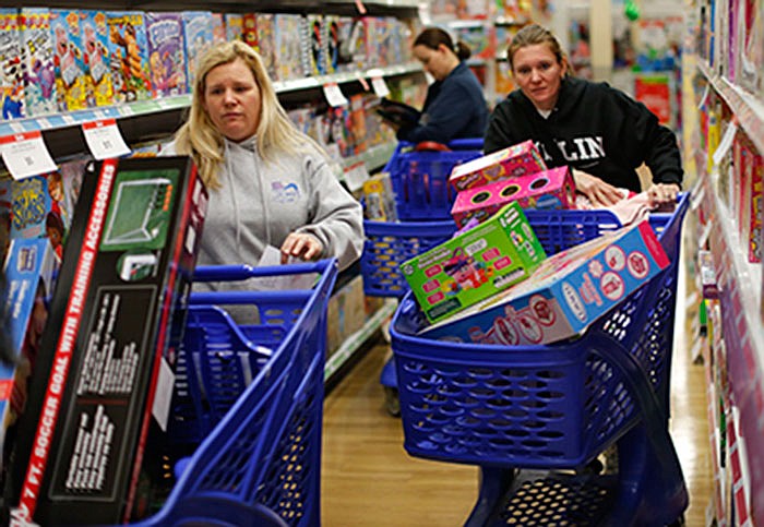 Cousins Stacy Levine, left, and Melissa Bragg shop at a Toys R Us store in Atlanta on Black Friday last year. 