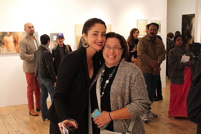 HALO founder Rebecca Welsh poses with HALO board of directors member Suzanne Alewine at the "Bloom" exhibit in the Slag Gallery in Brooklyn.