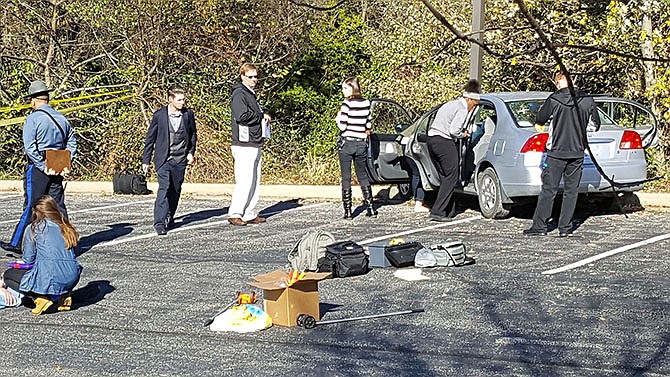 Students investigate a mock crime scene at this week's state finals of the Missouri Constitution Project. 