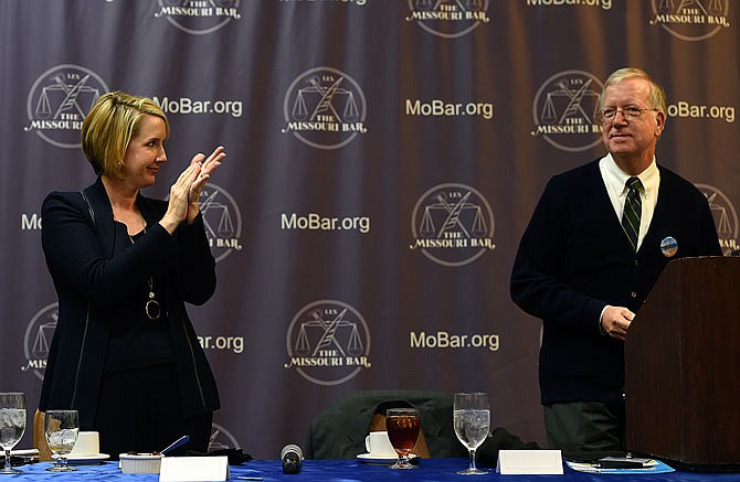 Incoming Missouri Supreme Court Clerk, Betsy AuBuchon applauds current Clerk Bill Thompson at the Missouri Bar Board's fall meeting Friday at Capitol Plaza Hotel.