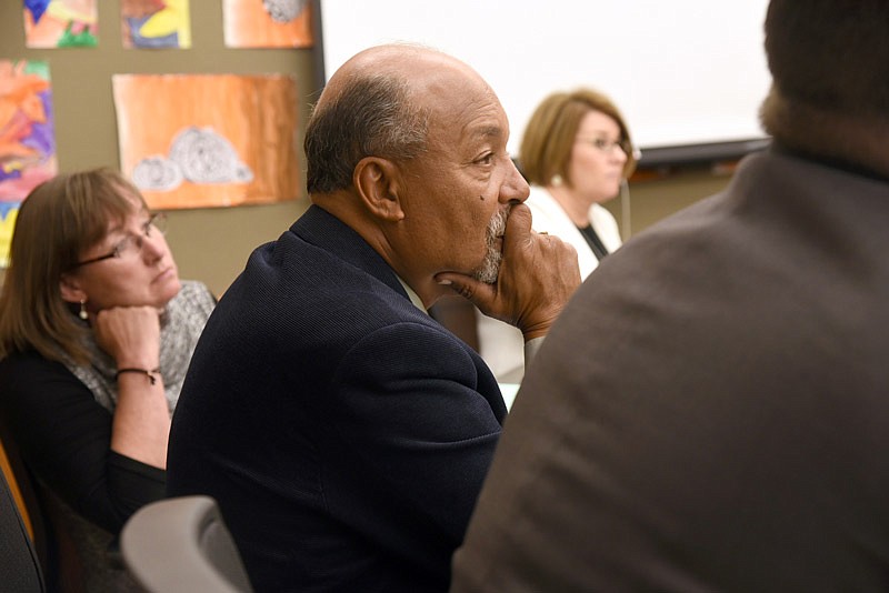Jefferson City Public Schools Board of Education member Michael Couty listens to people speaking at the board meeting on Monday, Nov. 14, 2016.