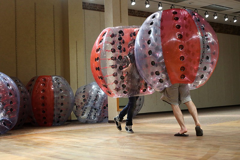 Sam Marshall, left, and Andrew Hopkins play Knockerball during the business' grand opening Friday, Nov. 18, 2016 at Capital Mall in Jefferson City. 