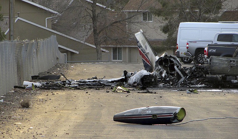 The wreckage of an American Medflight plane sits in the Barrick Gold Corp. parking lot  in Elko, Nev., Saturday, Nov. 19, 2016.  The Federal Aviation Administration and the National Transportation safety board will investigate the fiery crash in northern Nevada in which all four people aboard the air-ambulance flight were reported killed.  