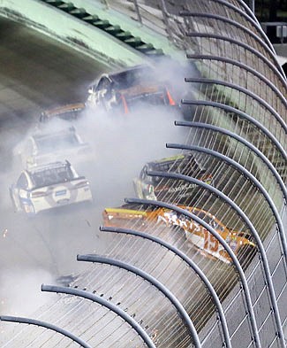 Carl Edwards crashes into the wall late in Sunday's race in Homestead, Fla.
