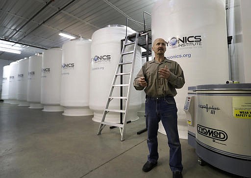 Andy Zawacki, the facility manager at the Cryonics Institute stands next to storage containers at the facility, Monday, Nov. 21, 2016 in Clinton Township, Mich. The remains of a 14-year-old London girl whose dying wish was to be cryogenically preserved with the hope with the hope she could continue her life in the future when cancer is cured are being kept at the Michigan-based Cryonics Institute. The unidentified girl's remains were brought to the facility last month after a British High Court judge granted her wish.