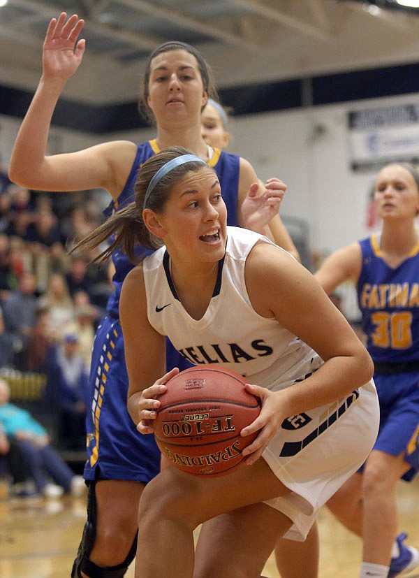 Helias senior Ashley Rehagen looks to make a move under the basket during Friday's Jamboree at Rackers Fieldhouse.