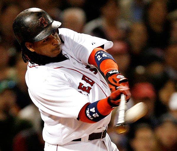 In this May 3, 2007, file photo, Manny Ramirez of the Red Sox connects on a two-run home run against the Mariners during a game at Fenway Park in Boston. Steroids-tainted stars Ramirez and Ivan Rodriguez are on baseball's Hall of Fame ballot for the first time along with Vladimir Guerrero.