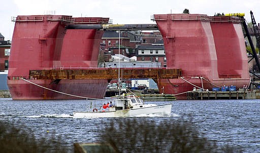 In this April 26, 2002, file photo, a section of a giant oil rig is docked after arriving at the Portland Ocean Terminal in Portland, Maine. The controversy over drilling for oil in the Atlantic Ocean has been reignited by the election of Donald Trump, and environmentalists and coastal businesses say it could be the first major fault line that divides them from the new president.