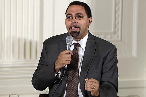 In this July 19, 2016, file photo, Education Secretary John B. King, Jr., speaks on a panel to college-bound students during an event in the East Room of the White House in Washington. 