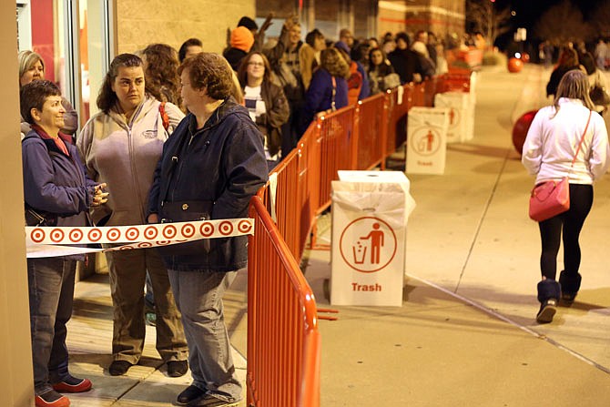 From left, Sherry Cleveland, Frances Boswell and Donna Barnes are the first in line outside of Target in Jefferson City on Thanksgiving Day. The store opened at 6 p.m. with approximately 300 people in line for Black Friday deals. Barnes said she had been waiting since 3 p.m.