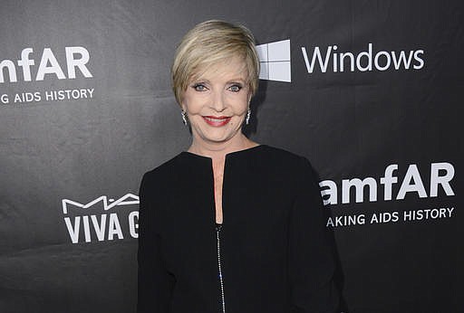  In this Oct. 29, 2014 file photo, Florence Henderson arrives at the 2014 amfAR Inspiration Gala at Milk Studios in Los Angeles. Henderson, the wholesome actress who went from Broadway star to television icon when she became Carol Brady, the ever-cheerful mom residing over "The Brady Bunch," has died at age 82. She died surrounded by family and friends, her manager, Kayla Pressman, said in a statement late Thursday, Nov. 24, 2016. (Photo by Jordan Strauss/Invision/AP, File)