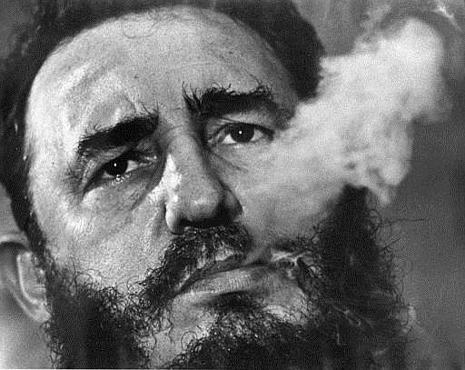 In this March 1985 file photo, Cuba's leader Fidel Castro exhales cigar smoke during an interview at the presidential palace in Havana, Cuba. Castro has died at age 90. President Raul Castro said on state television that his older brother died late Friday, Nov. 25, 2016. 