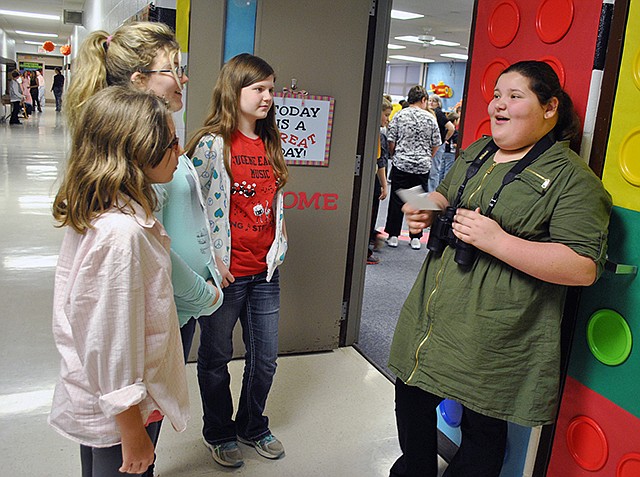 Sixth-grader Leah Moore talks with fellow students about her Living Museum famous person, Jane Goodall, during the annual event Tuesday at Eugene Elementary.