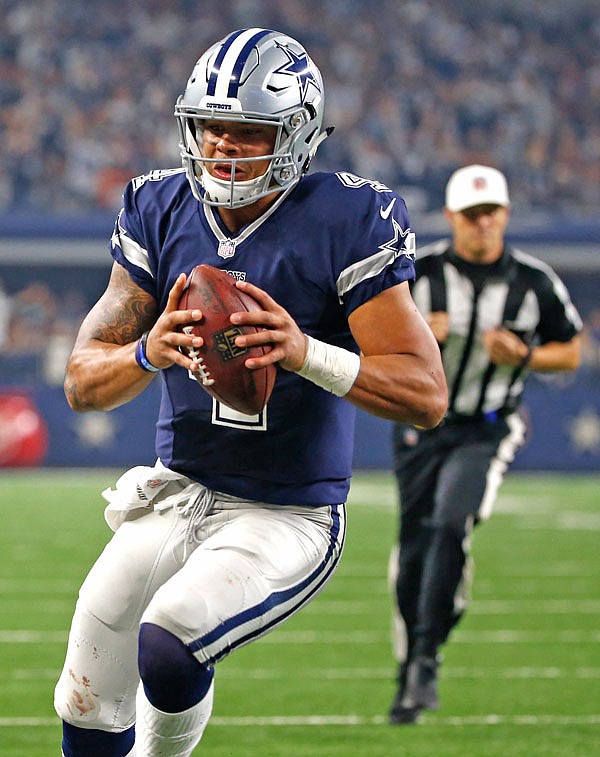 Cowboys quarterback Dak Prescott runs for a touchdown against the Redskins during the second half of Thursday's game in Arlington, Texas.