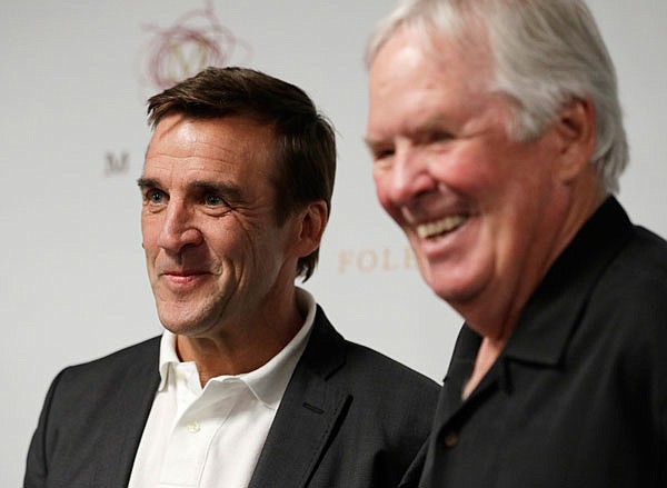 In this July 13 file photo, George McPhee (left) and NHL's expansion Las Vegas franchise owner Bill Foley attend a news conference in Las Vegas. Preparations for the Vegas Golden Knights' expansion draft is well underway around the NHL.