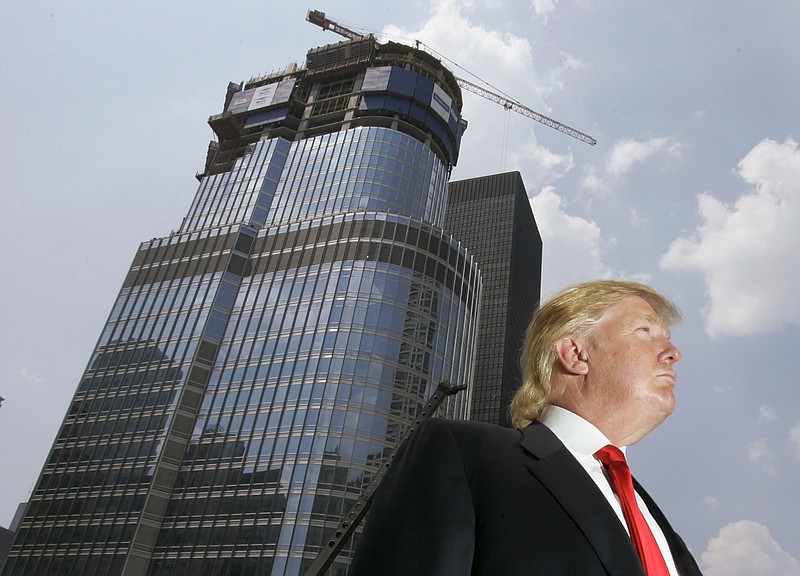 In this May 24, 2007, file photo, Donald Trump is profiled against his then-under construction 92-story Trump International Hotel & Tower in Chicago. Trump's hands-on, minutiae-obsessed management style will be tested by the presidency, a job in which his predecessor says that only the biggest and most difficult decisions even make the president's desk. 
