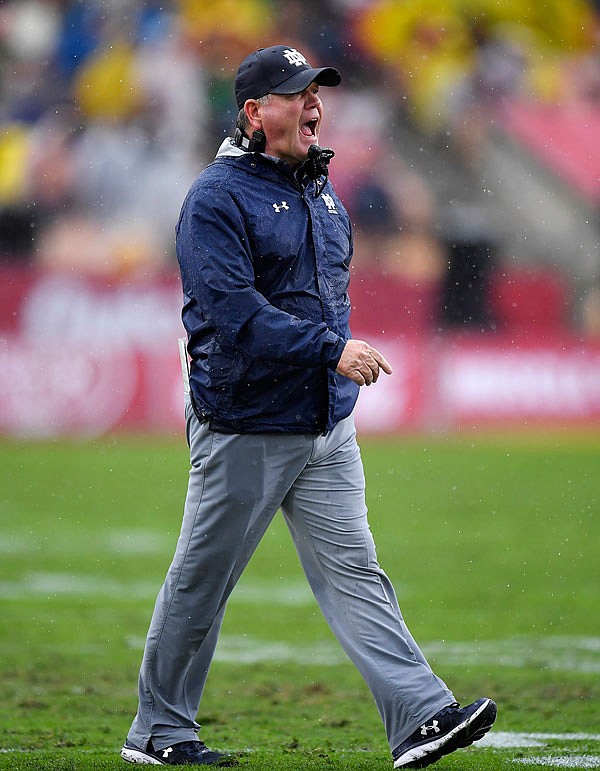 Notre Dame head coach Brian Kelly yells to his team during the first half of Saturday's game against Southern California, in Los Angeles.