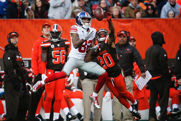 Browns cornerback Briean Boddy-Calhoun breaks up a pass to Giants wide receiver Roger Lewis in the second half of Sunday's game in Cleveland.