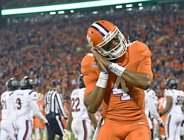 Clemson quarterback Deshaun Watson reacts after throwing a touchdown pass to Artavis Scott during the second half of Saturday's game against South Carolina in Clemson, S.C.