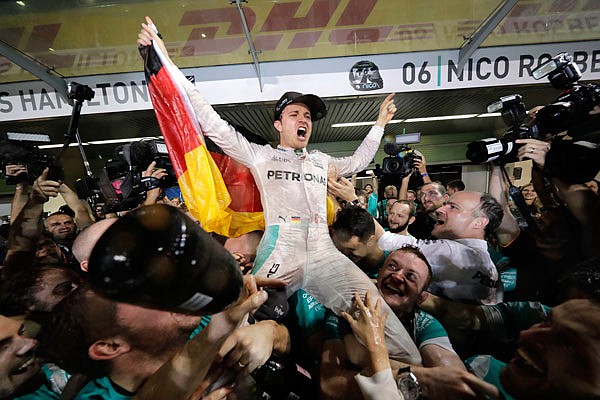 Mercedes driver Nico Rosberg celebrates winning the World Championship during the Emirates Formula One Grand Prix on Sunday at the Yas Marina racetrack in Abu Dhabi, United Arab Emirates.