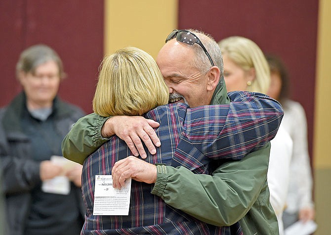 Melissa Friel, left, reunites with Mark Winkler at an emergency reunification drill during the Children and Youth in Disasters conference Tuesday at First United Methodist Church. Friel's character was Winkler's group home leader, and they reunited at the hospital following the "tornado."