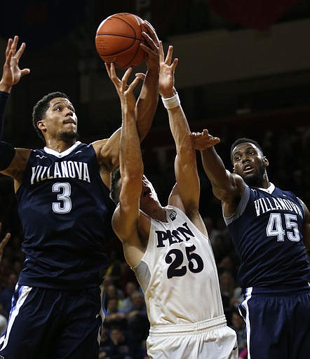 Villanova guard Josh Hart (3) and forward Darryl Reynolds (45) go up for a rebound against Pennsylvania forward AJ Brodeur (25) in the second half of an NCAA college basketball game, Tuesday, Nov. 29, 2016, in Philadelphia. Villanova won 82-57. 