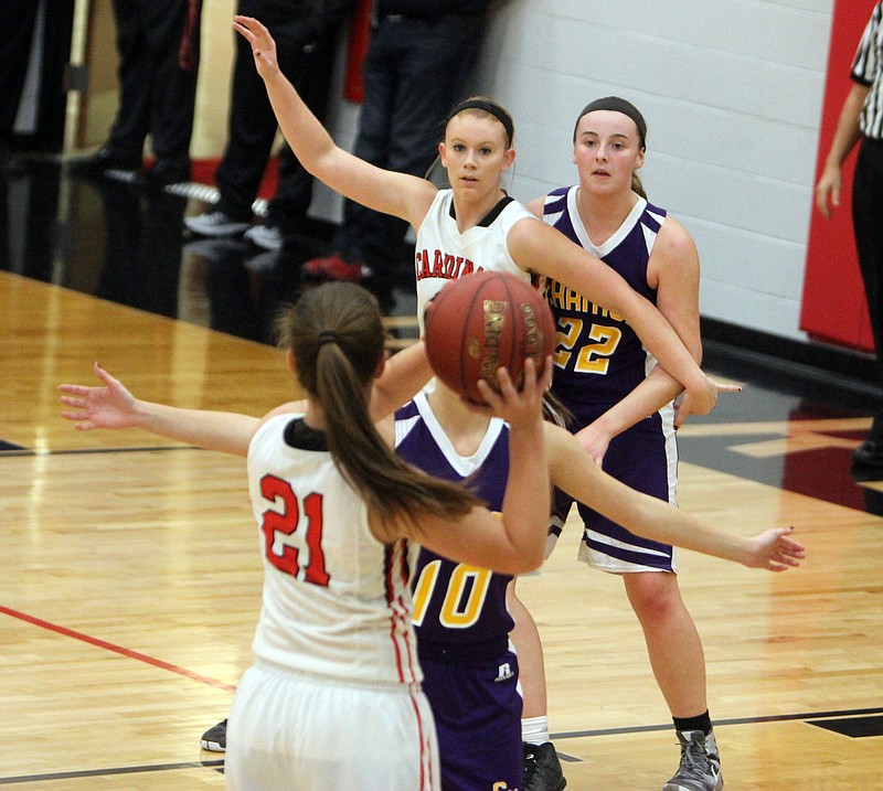 Tipton's Alyson Brant battles for post position in the Cardinals' 41-27 win over Chamois.