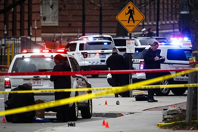 Crime scene investigators collect evidence from the pavement Monday as police respond to an attack on campus at Ohio State University in Columbus, Ohio. In chillingly detailed articles in a slick online magazine, Islamic State extremists exhorted English-language readers this fall to carry out attacks with knives and vehicles. Using those very methods, Somali-born student Abdul Razak Ali Artan injured multiple people in the attack at Ohio State University, authorities said.