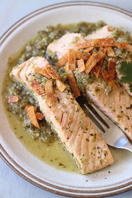 This photo shows salmon poached in green salsa and topped with baked chips in Concord, New Hampshire. This dish is from a recipe by Sara Moulton.