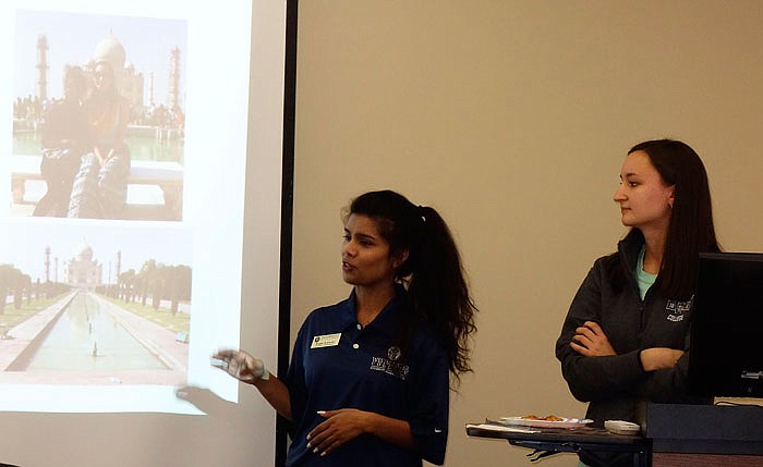 Westminster College students Rupa Kumari and Tiffany Crawford discuss a trip they made together last spring to India, Kumari's home country, as part of the college's "Take a Friend Home" experience.