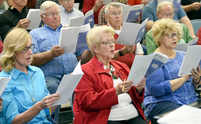 From left, Lori Staub, Rita Dudenhoeffer and Melinda Kimlinger practice at the Cantorum rehearsal at First Baptist Church in Jefferson City.