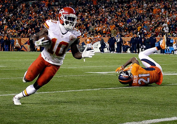 Tyreek Hill of the Chiefs turns the corner on his way to a touchdown during Sunday night's game against the Broncos in Denver.