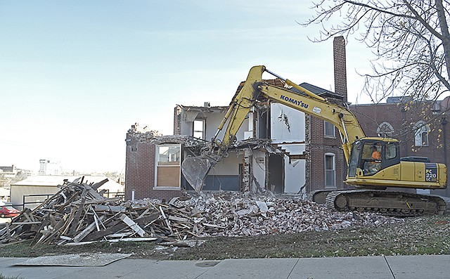 Demolition begins Thursday, Dec. 1, 2016 at the Central United Church of Christ's parsonage in Jefferson City. 