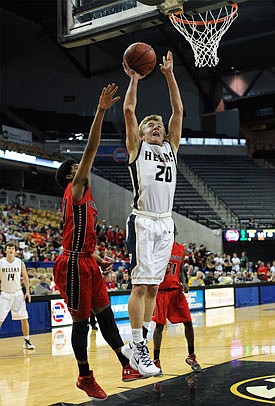 Landon Harrison of Helias goes up for a basket during last season's Class 3 third-place game against Sikeston at Mizzou Arena.