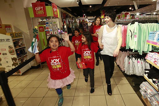 Carly Rae Jepsen teams up with JCPenney to give joy this holiday season on Wednesday, Nov. 30, 2016, in New York. Carly takes kids from the Y shopping to select gifts for their family and friends. in addition, JCPenney donated $100,000 to the Y to help strengthen local communities.(Photo by Mark Von Holden/Invision for JCPenney/AP Images)