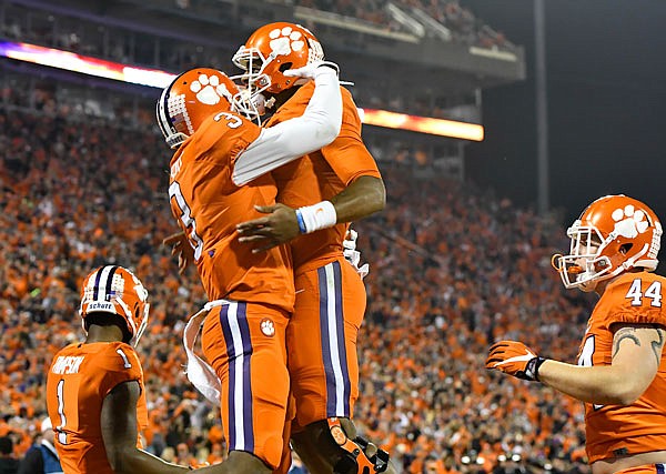 Clemson's Artavis Scott (left) and Deshaun Watson celebrate a touchdown during last Saturday's game against South Carolina in Clemson, S.C. 