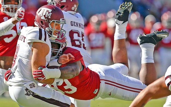 Alabama defensive lineman Jonathan Allen sacks Texas A&M quarterback Trevor Knight during a game earlier this season in Tuscaloosa, Ala. The SEC's two stingiest defenses will take the field today in the league championship game.