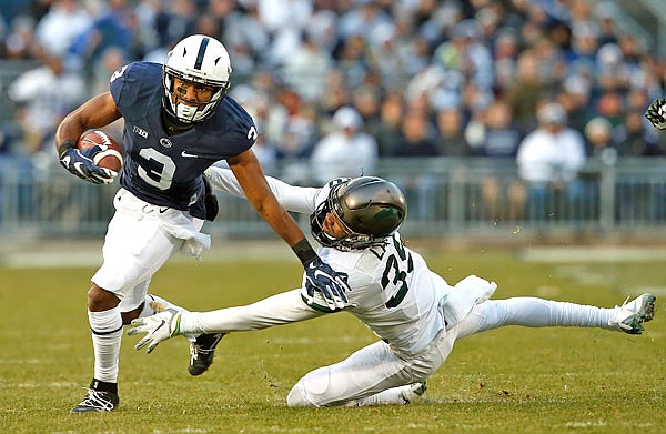 Penn State's DeAndre Thompkins gets past Michigan State's Justin Layne after a catch during last Saturday's game in State College, Pa. Wisconsin's defense will face a big-play test against Penn State in tonight's Big Ten championship game.