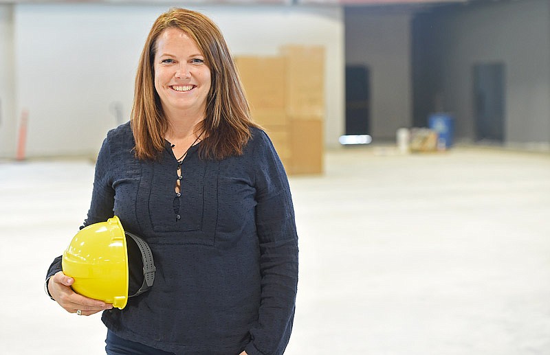 Angie Toebben holds a hard hat in the future Wellness Center. Toebben is the recreation program supervisor for the Jefferson City Parks, Recreation and Forestry Department.