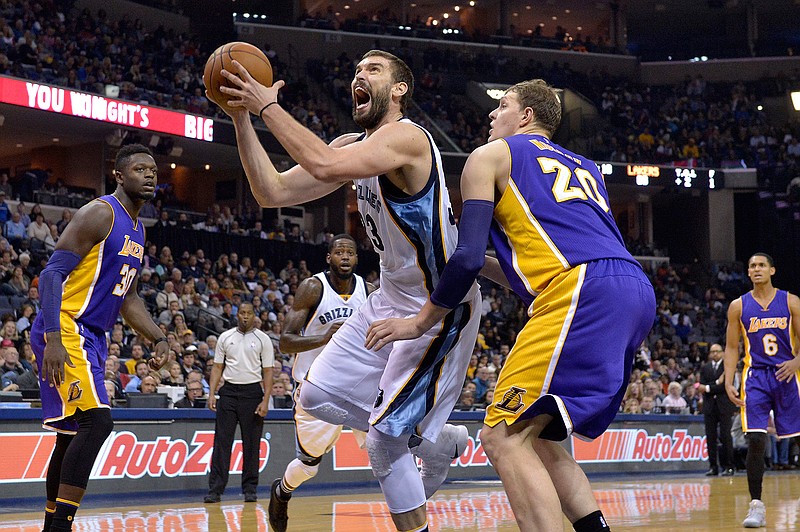 Memphis Grizzlies center Marc Gasol (33) drives against Los Angeles Lakers center Timofey Mozgov (20) in the second half of an NBA basketball game Saturday, Dec. 3, 2016, in Memphis, Tenn. 