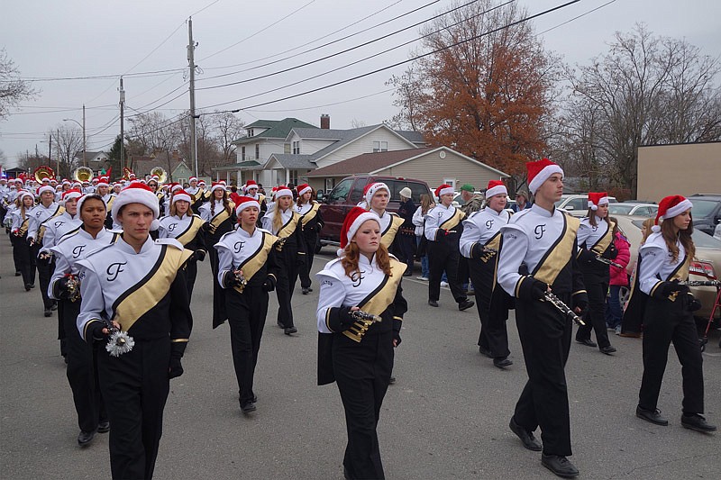 Fulton High School's marching band concentrates on keeping in step during the 68th annual Fulton Jaycees Christmas parade Saturday, Dec. 3, 2016.