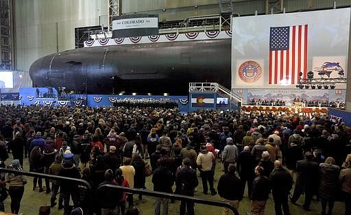 Hundreds gather as General Dynamics Electric Boat hosts the christening ceremony for the USS Colorado in Groton, Conn., on Saturday, Dec. 3, 2016. The 377-foot-long vessel is the 15th in the Virginia class of attack submarines, each costing $2.7 billion.