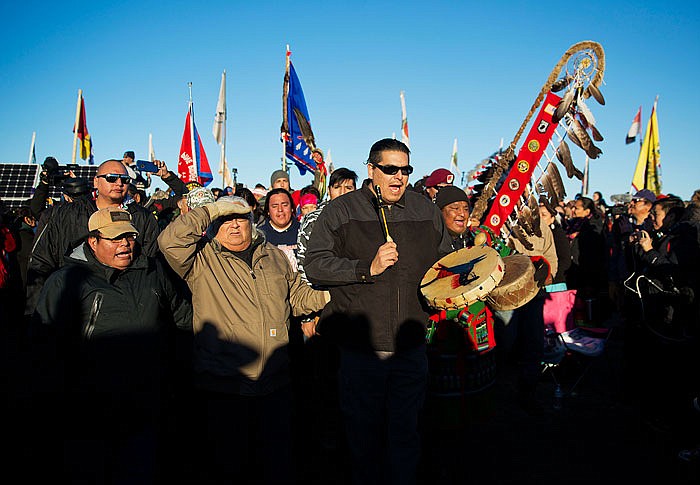 A Native American drum procession moves through the Oceti Sakowin camp after it was announced that the U.S. Army Corps of Engineers won't grant easement for the Dakota Access oil pipeline in Cannon Ball, North Dakota.