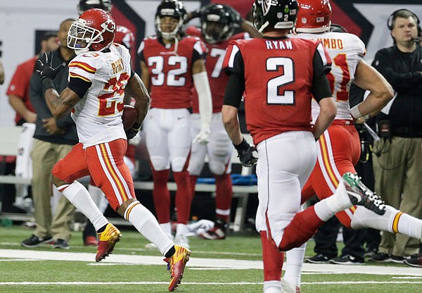 Eric Berry of the Chiefs looks back as he returns an interception thrown by Falcons quarterback Matt Ryan on a 2-point conversion attempt during Sunday afternoon's game in Atlanta.