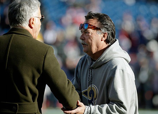 Rams head coach Jeff Fisher shakes hands with team owner Stan Kroenke before Sunday's game against the Patriots in Foxborough, Mass.